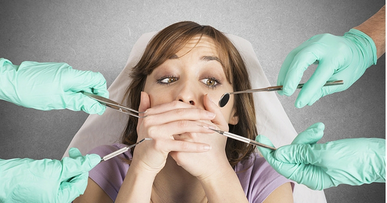 woman afraid of dental instruments because of dental anxiety